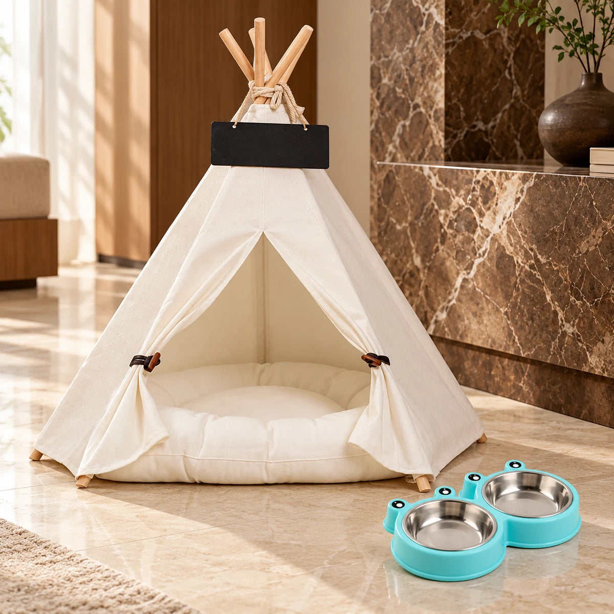 White canvas pet teepee with cushion and turquoise frog double feeding bowl in a warm marble interior