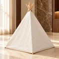 Cargar la imagen en la vista de la galería, Rear exterior of white canvas pet teepee with wooden poles in a warm marble interior
