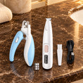 Load image into Gallery viewer, White pet trimmer kit with blue nail clipper and three button batteries
