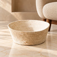 Charger l'image dans la visionneuse de la galerie, Open woven cat bed in a natural cream colour on light ivory-beige marble beside a cream upholstered chair.
