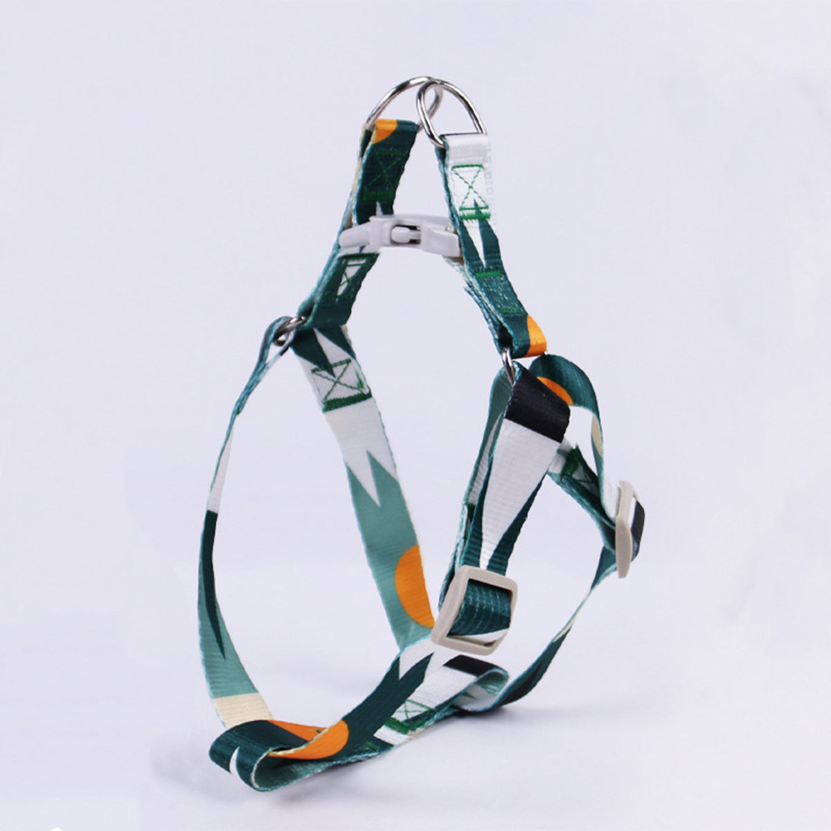 Close-up of green and white nylon dog harness with plastic buckle on white background