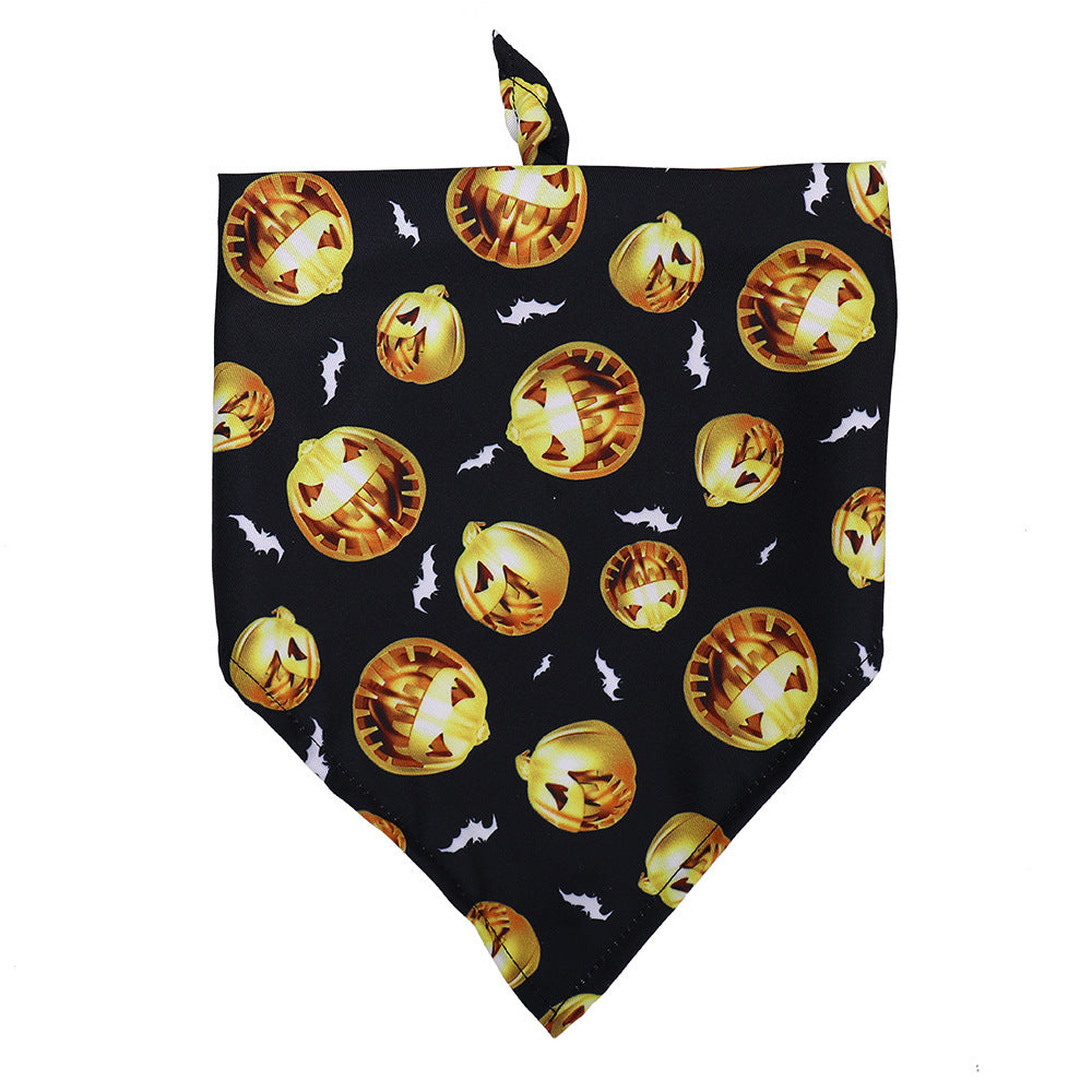 Close-up of black dog bandana adorned with orange jack-o'-lantern pumpkins and small bats