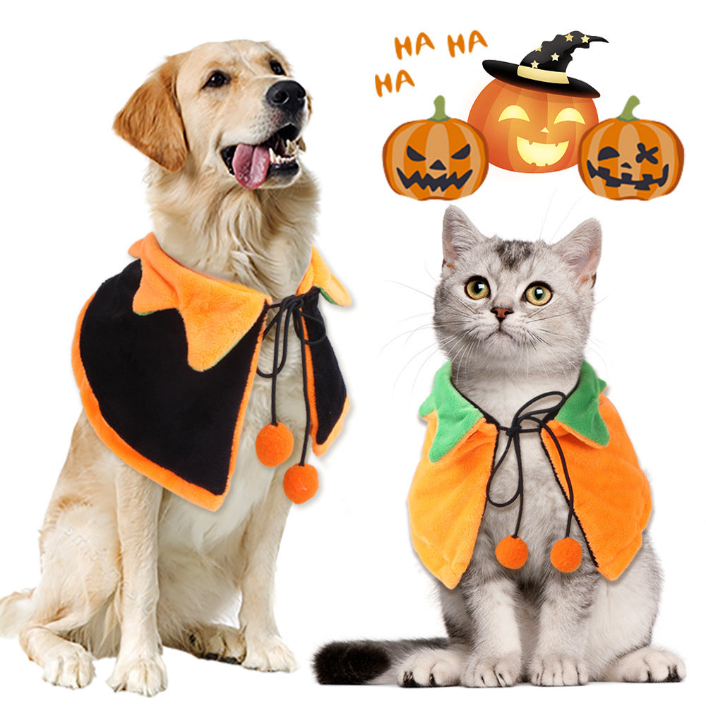 Golden retriever dog wearing a reversible pumpkin pet cloak with black and orange sides, tied with string and pom-poms, sitting next to a gray cat wearing an orange pumpkin cloak and green collar with Halloween pumpkin illustrations above.