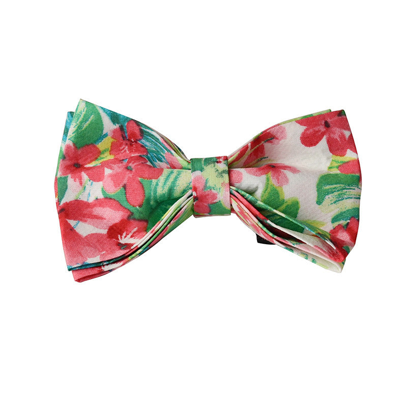 Side view of red floral dog collar with gold buckle