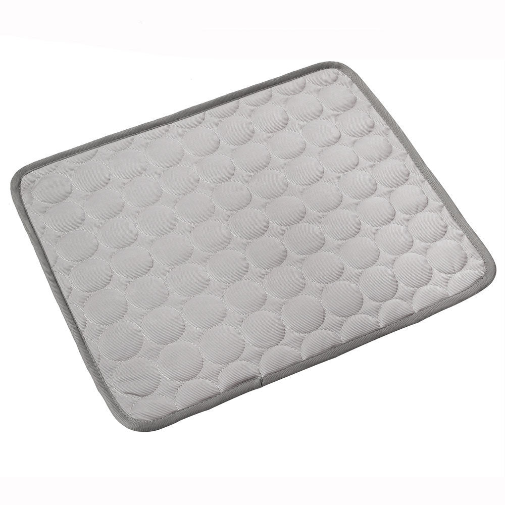 Close-up of dark gray quilted pet cooling mat edging and texture