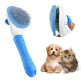 Load image into Gallery viewer, Blue pet grooming brush with release button held in hand
