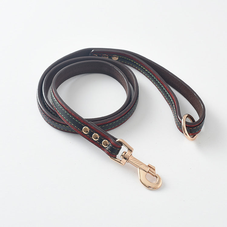 Coiled brown PU leather dog leash with rose gold clasp on white background