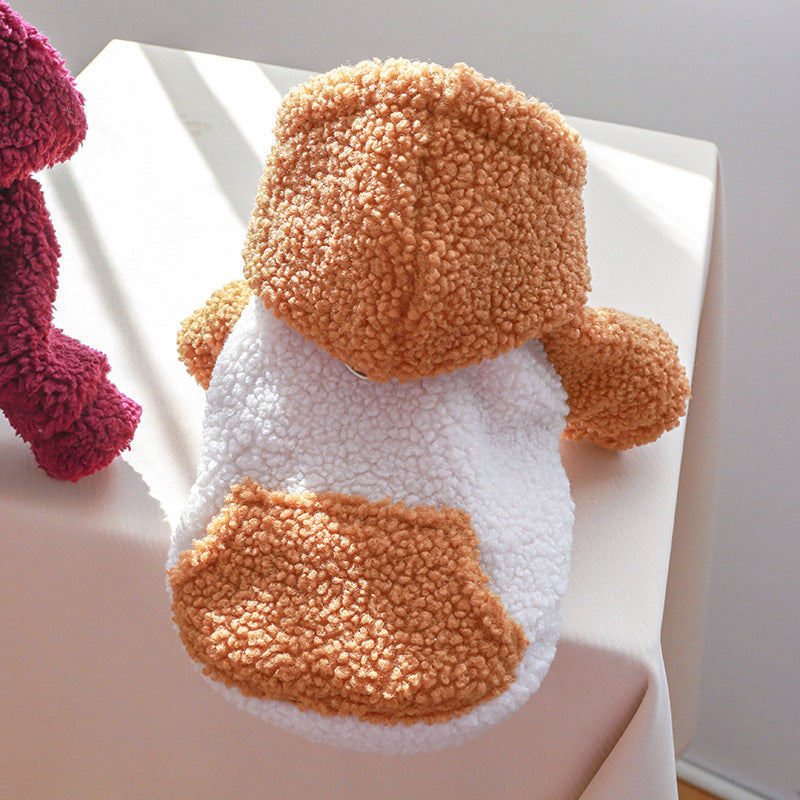 Close-up of burnt orange and white lamb fleece dog sweater showing pocket and hood detail