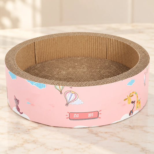 Pink illustrated cardboard cat scratcher bowl with balloons and animals on ivory marble
