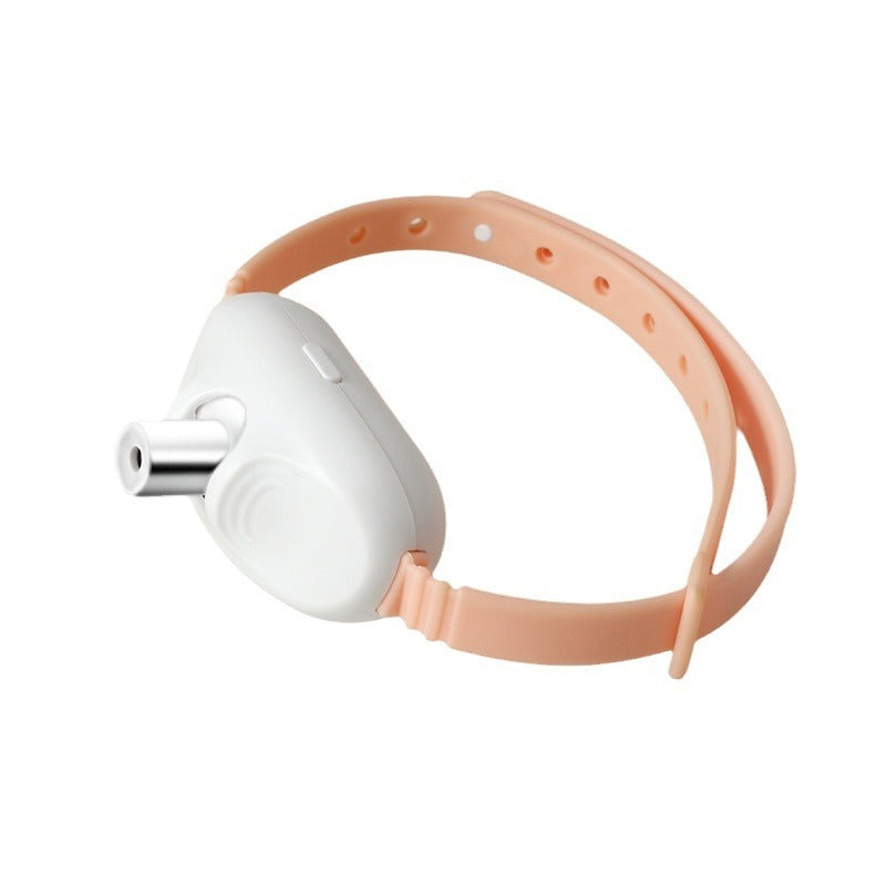 Peach silicone laser cat collar with white laser device on plain background