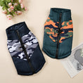 Cargar la imagen en la vista de la galería, Two padded dog jackets shown side by side, one green/orange camo and one black/white camo
