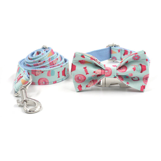 Close-up of adjustable dog collar and leash featuring playful cupcake, candy, and donut patterns  