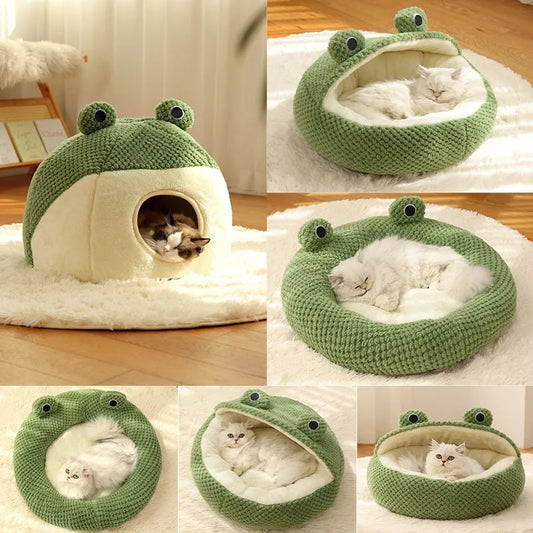 Closed frog-shaped knitted pet bed in green with cream plush interior and cat resting inside on a wooden floor