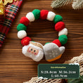 Load image into Gallery viewer, Plush Christmas collar with red and green felt balls featuring a Santa Claus face and a snowflake mitten plush ornament
