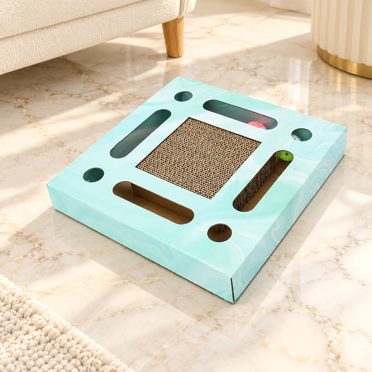 Square mint corrugated cat scratcher on pale ivory marble