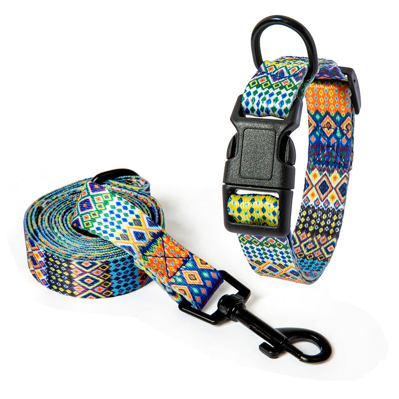 Set of dog collar and matching leash in yellow and blue tribal design displayed on white background