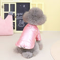 Charger l'image dans la visionneuse de la galerie, Small grey fluffy dog wearing a pink waterproof padded dog jacket sitting beside a pink crown-shaped pillow
