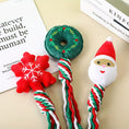 Charger l'image dans la visionneuse de la galerie, Close-up of three Christmas dog toys showing wreath, snowflake, and Santa plush tops with twisted ropes
