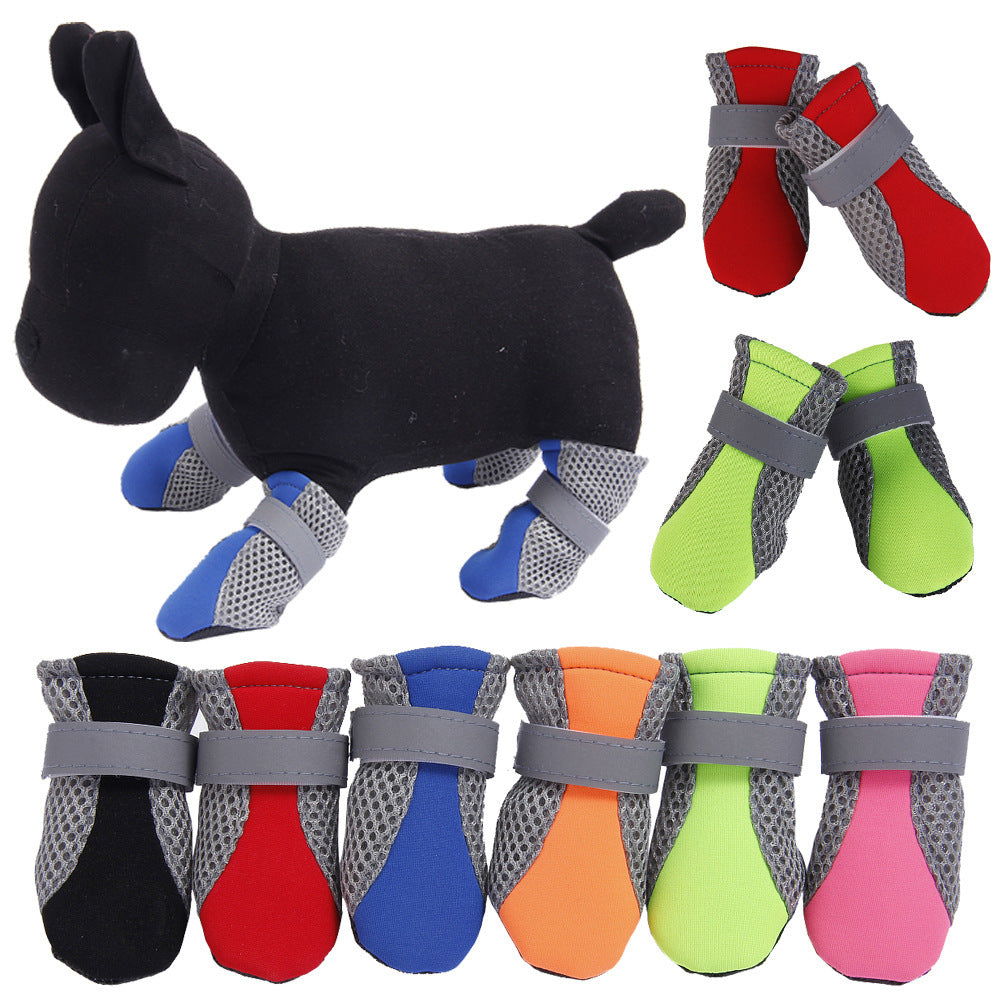 Black dog mannequin wearing blue breathable dog walking shoes with gray mesh sides