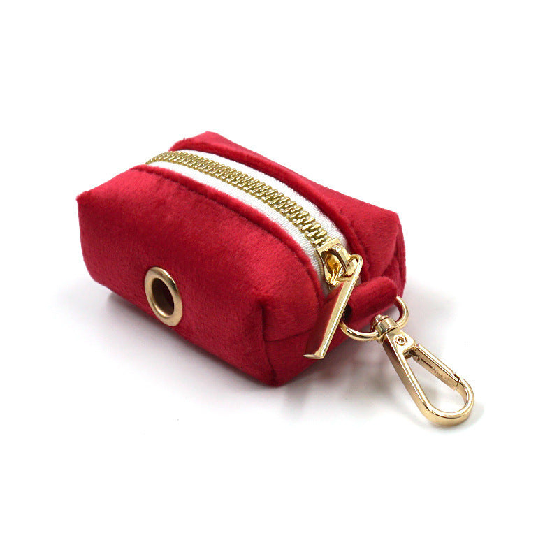 Rolled red velvet leash featuring gold hardware