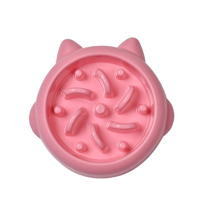 Top view of pink slow feeder bowl featuring bone and knob pattern