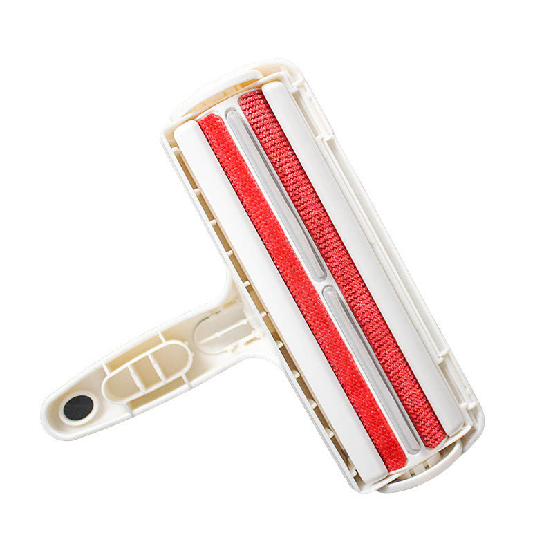 View of red lint-stripping surface on the underside of white pet hair remover roller