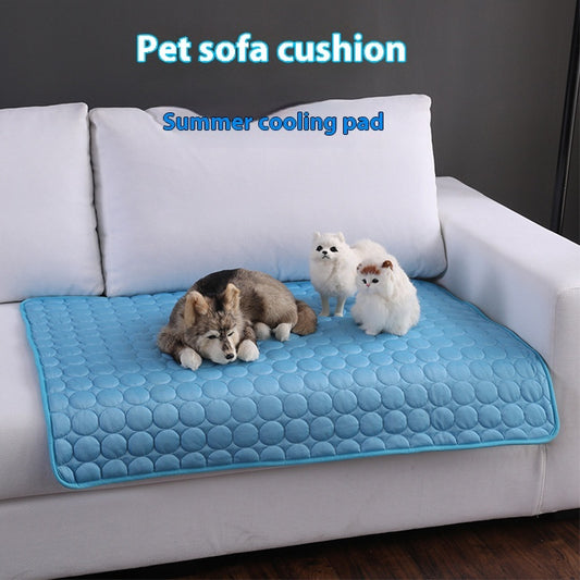Dog and cats resting on blue quilted pet sofa cooling mat on white couch