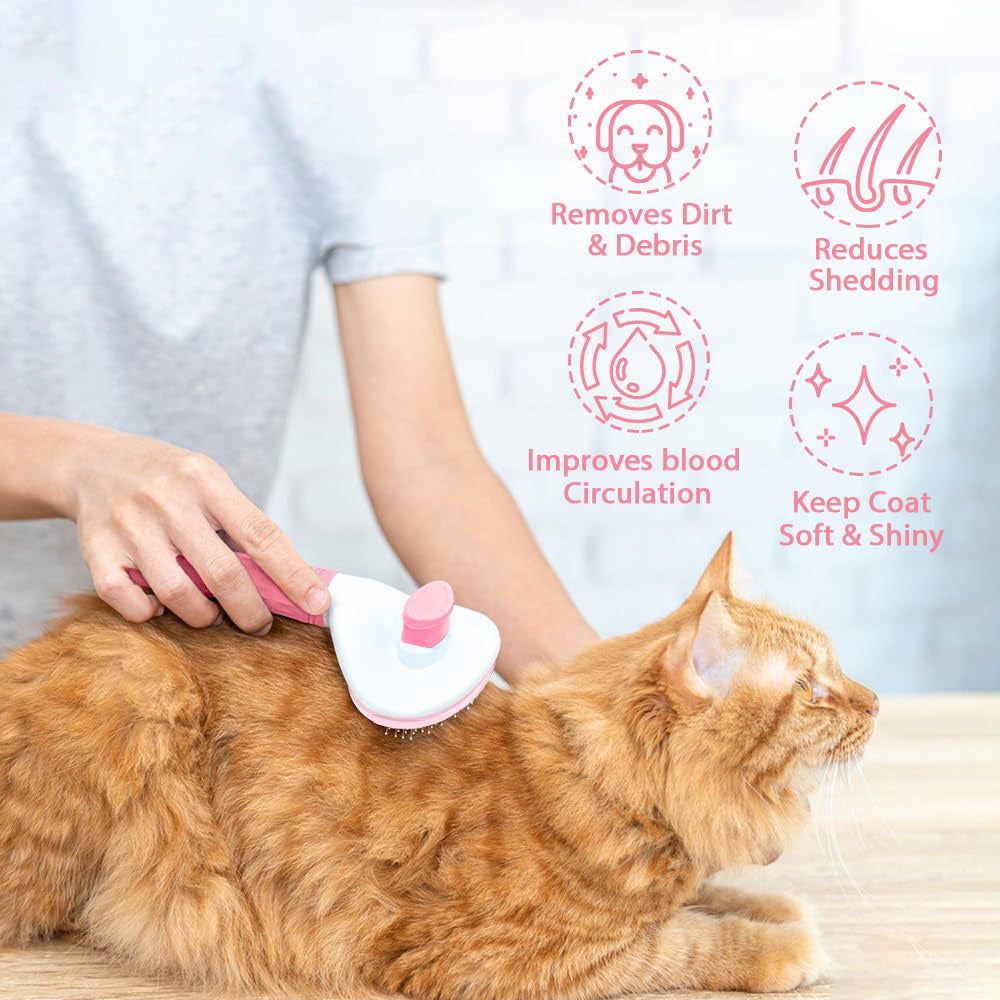 Person grooming an orange tabby cat using pink pet hair remover brush