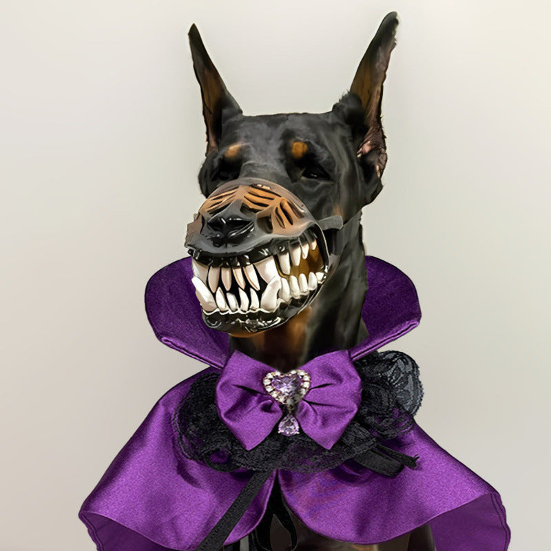 Doberman dog wearing a purple and black vampire cape with lace collar and jeweled purple bow tie, and a scary vampire teeth muzzle