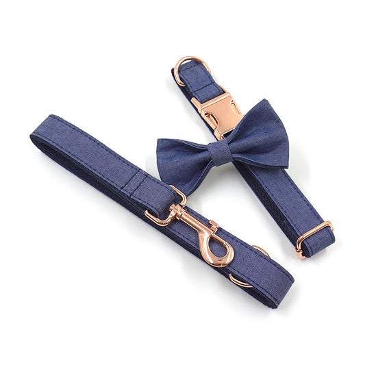 Deep denim pet collar and leash set with rose gold buckle and matching bow tie on white background