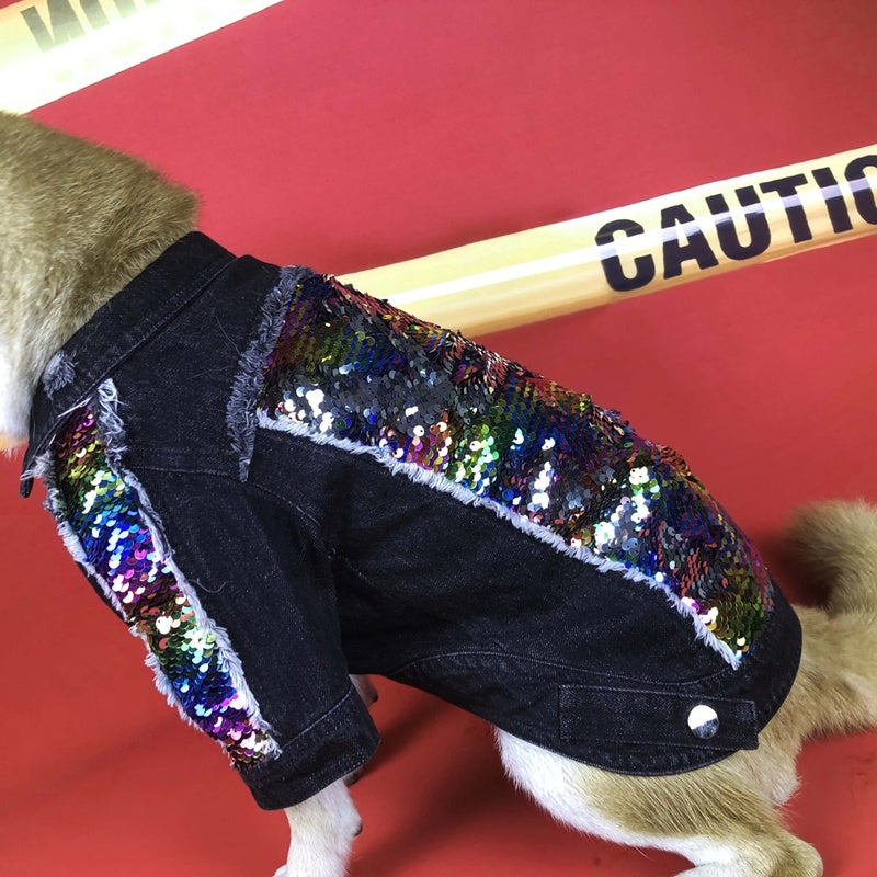 Side view of black denim dog jacket with bright rainbow sequin panel and frayed edges worn by dog