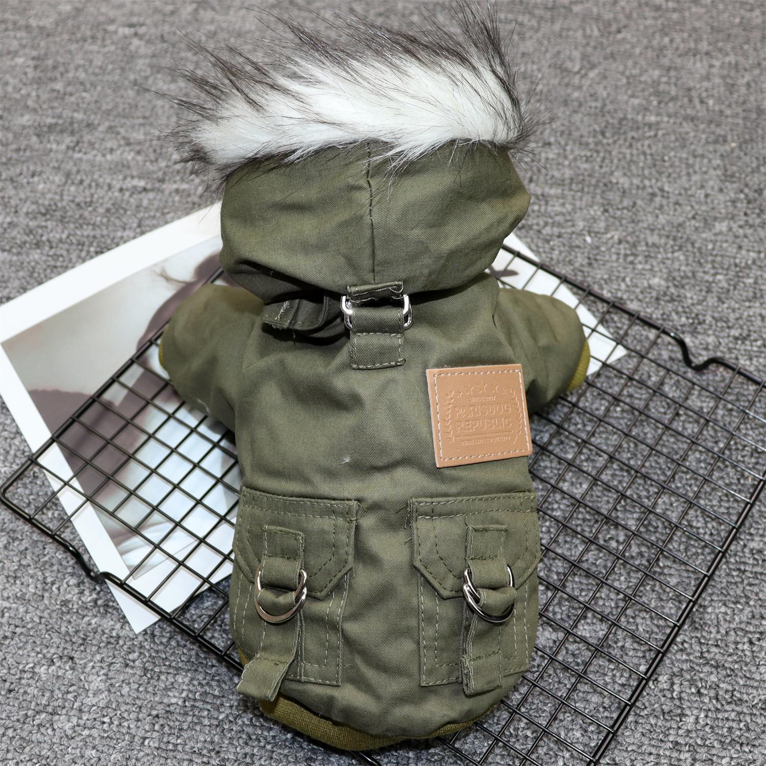 Back view of an olive green winter dog coat with faux fur-trimmed hood and decorative buckle pockets