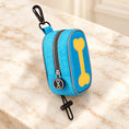 Cargar la imagen en la vista de la galería, Sky-blue bone-design waste-bag pouch with yellow bone motif, clip and toggle loop
