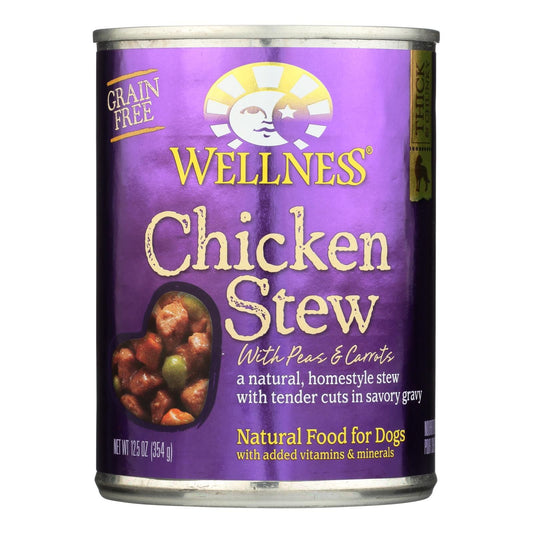 Wellness Chicken Stew dog food can with purple label showing peas and carrots in gravy