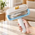 Load image into Gallery viewer, Duck-shaped pet hair remover with open lid showing the hair collection chamber
