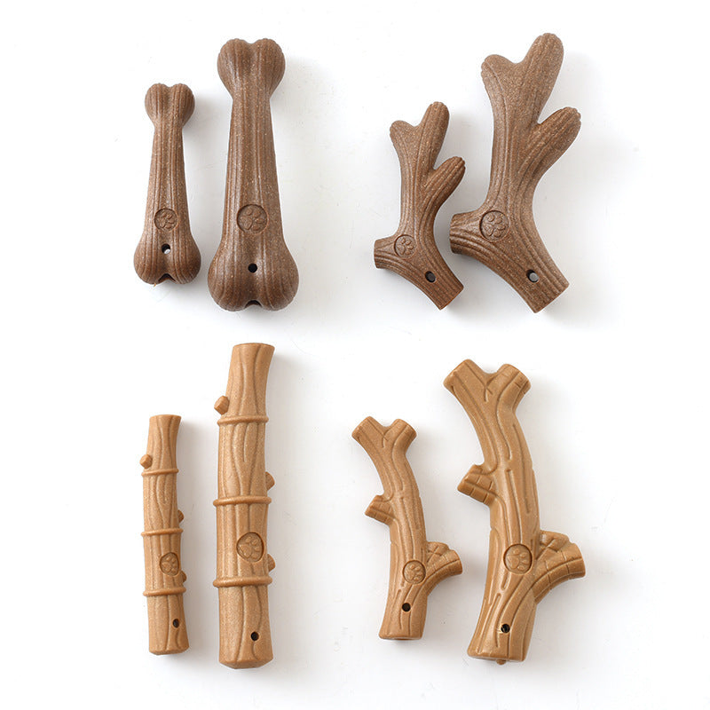 Collection of eight dog chew toys in stick and bone shapes in two colors on white background