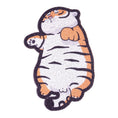 Cargar la imagen en la vista de la galería, Isolated fat tiger shaped cat litter mat with visible orange, white and black stripes
