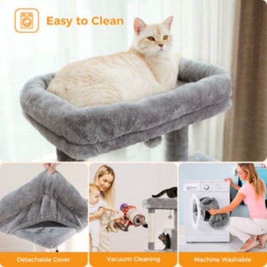 Cat resting on a soft gray removable hammock featured on an indoor cat tree with easy to clean label
