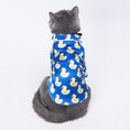 Load image into Gallery viewer, Top view of gray cat wearing the blue duck print shirt facing away
