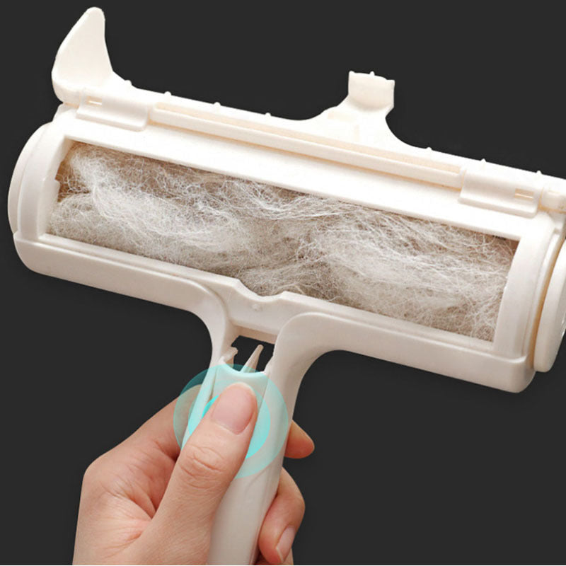 Close-up of person opening pet hair remover roller with pet hair collected inside