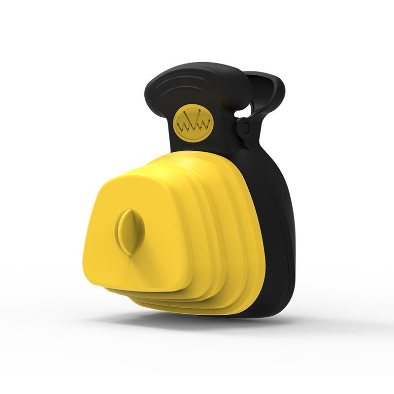 Yellow foldable silicone dog poop spoon dispenser with black handle, folded compact design