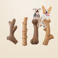 Load image into Gallery viewer, Four dog chew toys shaped like sticks and bones with two small happy dogs in background
