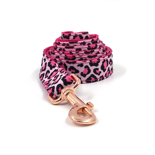 Close-up of rose gold metal clasp attached to pink leopard print leash