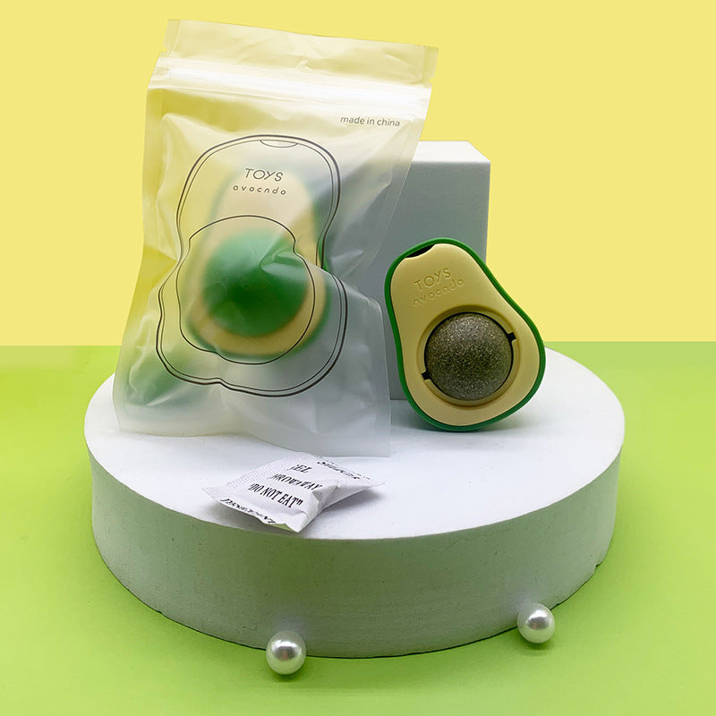 Avocado catnip toy in clear resealable packaging beside the toy and silica gel packet on display platform