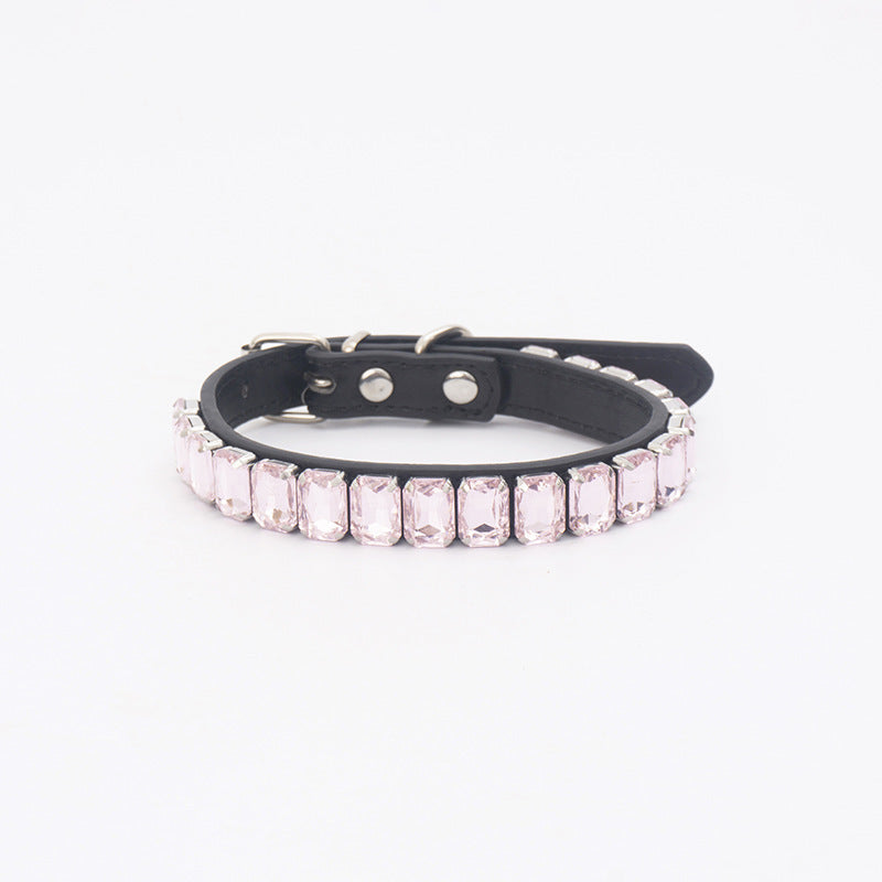 Light pink rhinestone PU pet collar laid flat on white background
