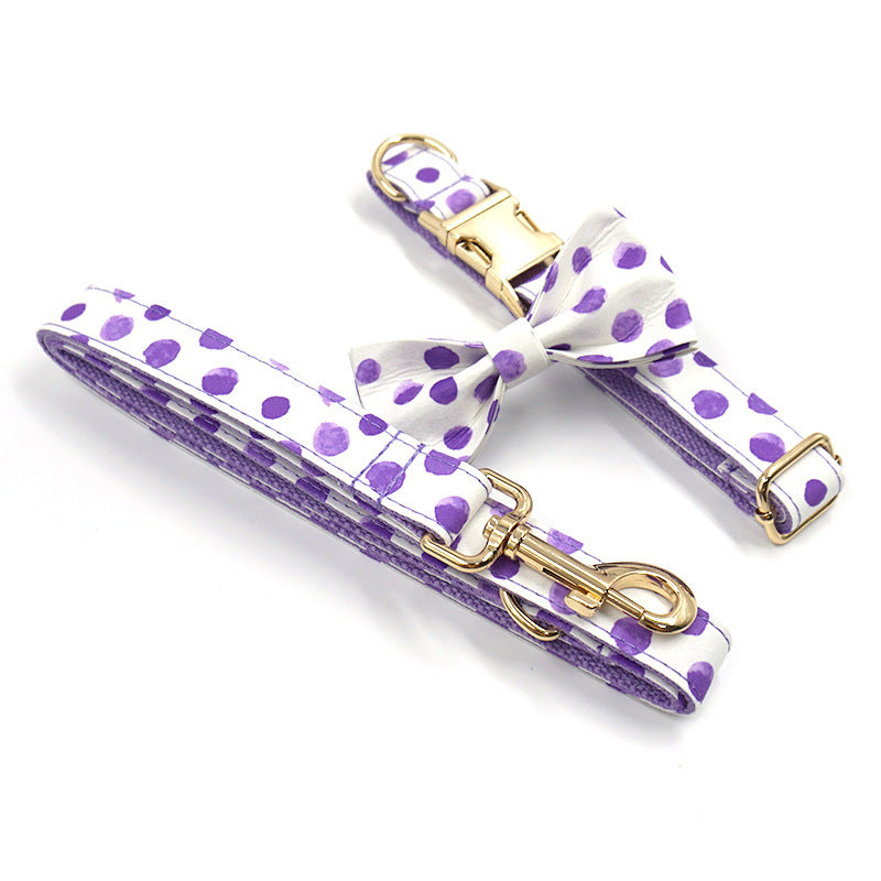 Purple polka dot dog collar with gold buckle and matching leash with gold clasp