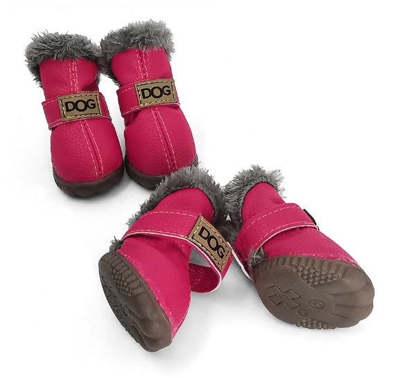 Bright pink winter dog boots with gray faux fur lining and adjustable straps