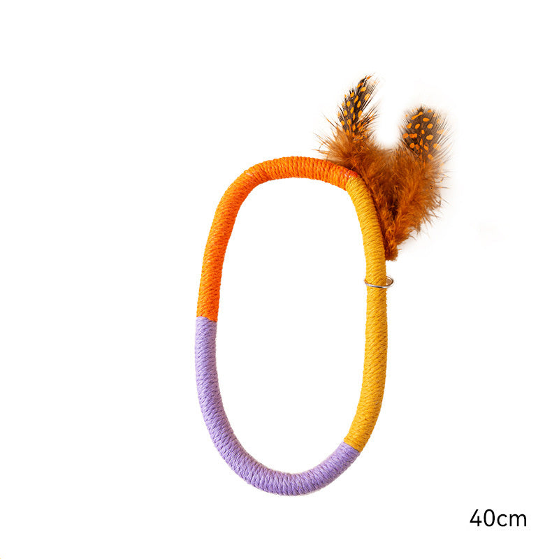 Orange, yellow, and purple cotton rope catnip toy with feather decoration, 40cm length displayed