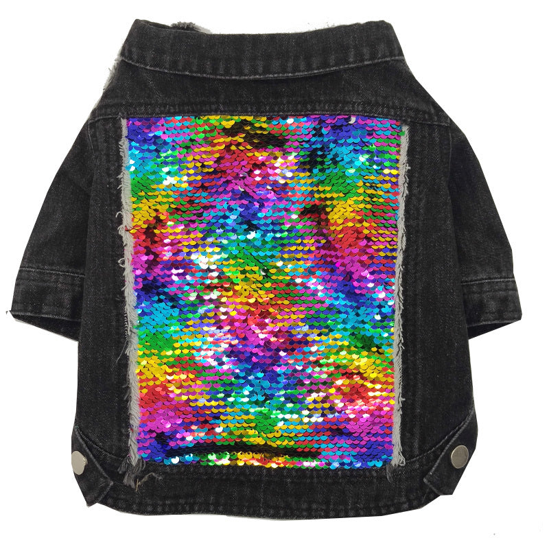 Flat lay of black denim dog jacket showing large multicolored sequin patch on back with frayed edges