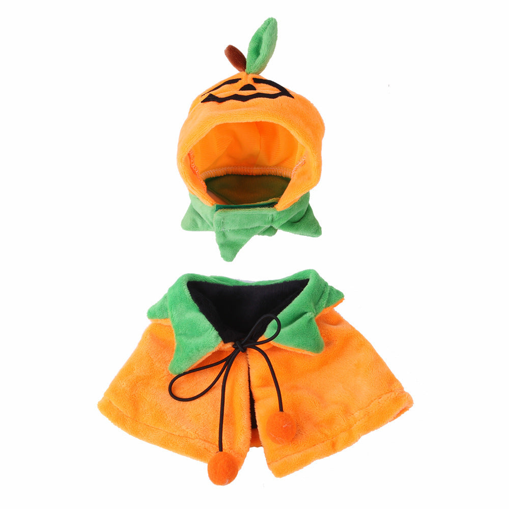 Pumpkin hat with green leaves on top and matching reversible pumpkin cloak with green collar and orange plush fabric displayed flat on a white background.